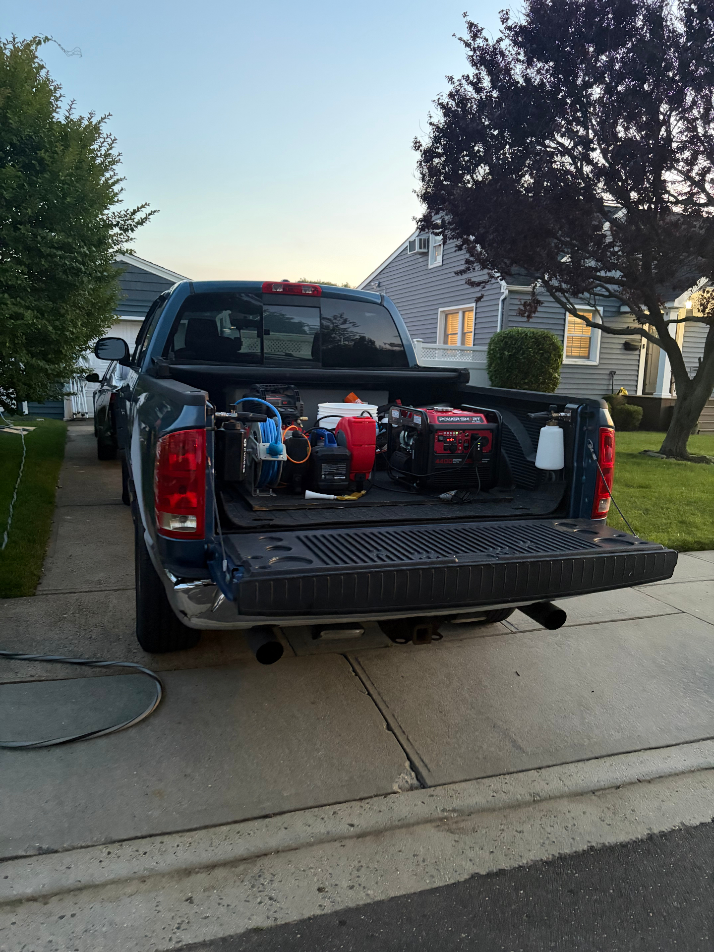 Focus Detailing truck with onboard generator and water tank set up in a Long Island driveway