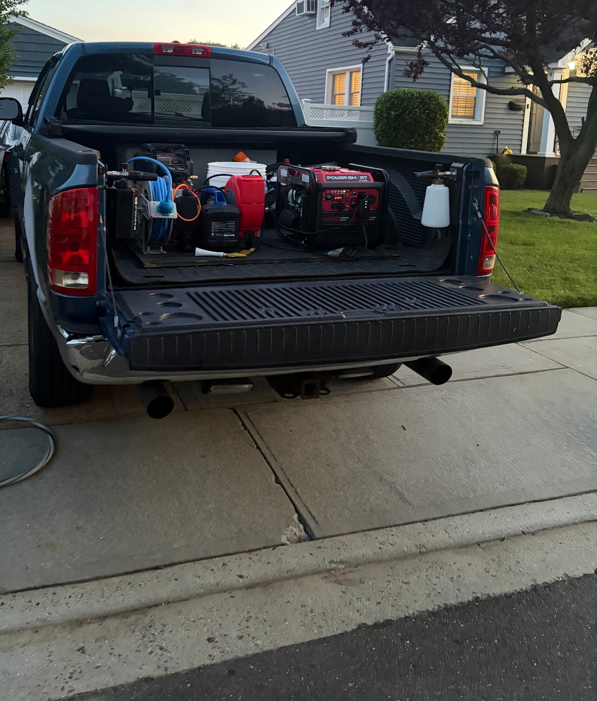 Focus Detailing truck with onboard generator and water tank set up in a Long Island driveway